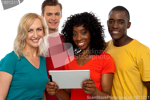 Image of Friends watching video on tablet pc