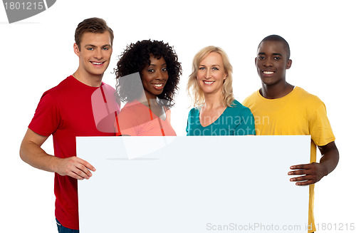 Image of Group of youth displaying blank advertise board