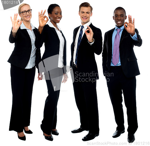 Image of Successful corporate team showing ok symbol