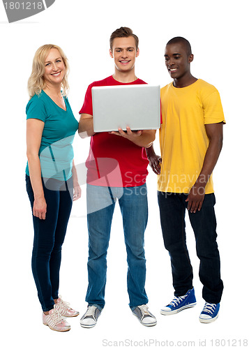 Image of Full length shot of teenagers with laptop