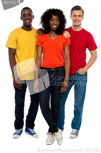Image of Trio of casual young friends posing in style