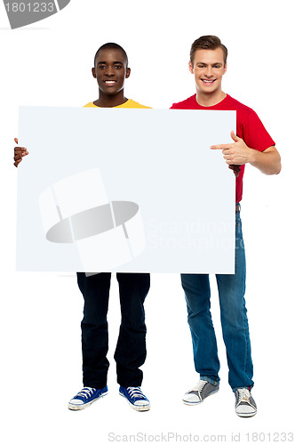 Image of Smiling guys with white ad board