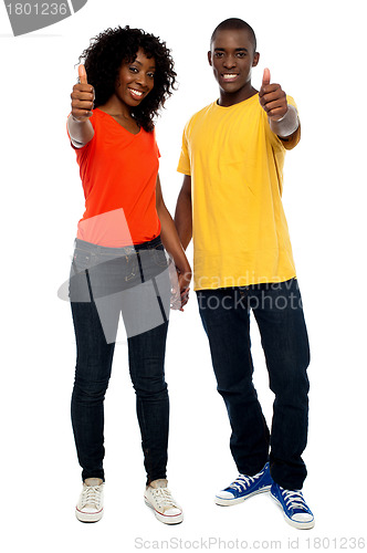 Image of Happy african couple showing thumbs up