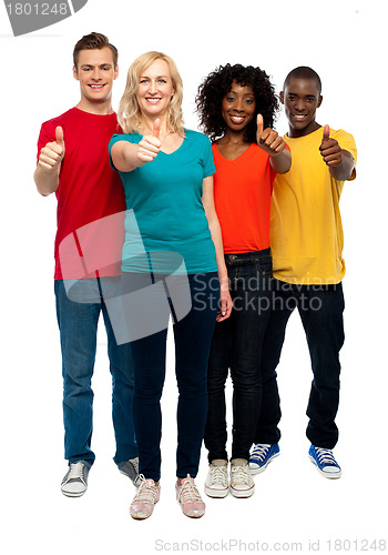 Image of Happy young teens gesturing thumbs up