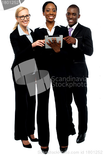 Image of Technology savvy business team using tablet pc