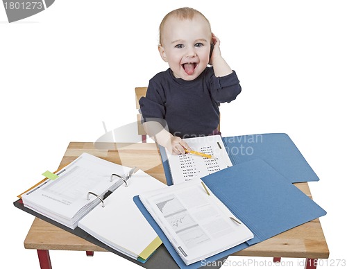 Image of young child at writing desk