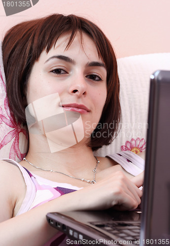 Image of Young woman with laptop 