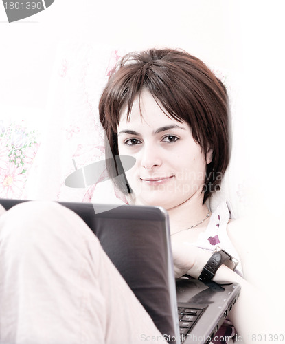 Image of Young woman with laptop 
