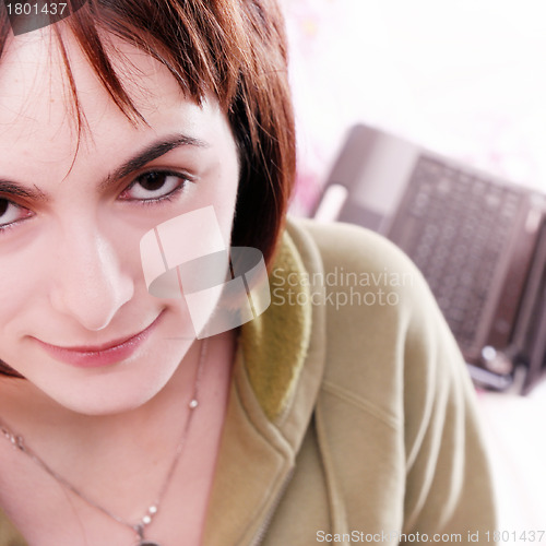 Image of Young woman in bed