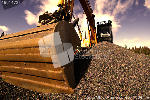 Image of excavator on construction of industrial factory