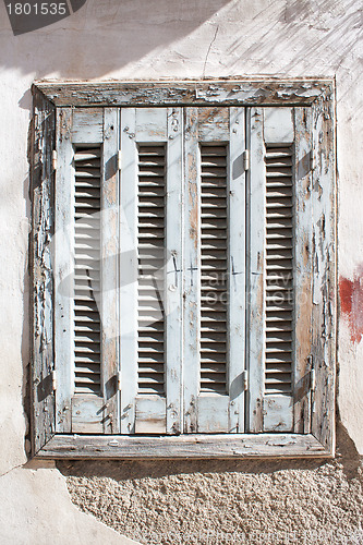 Image of Aged and neglected wooden window