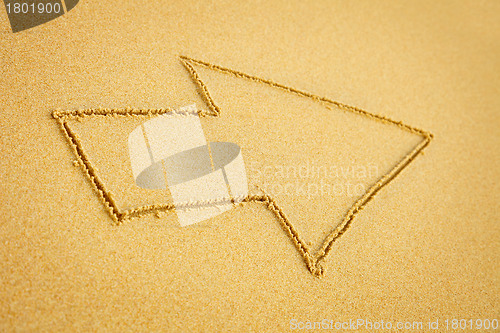 Image of Arrow on beach sand