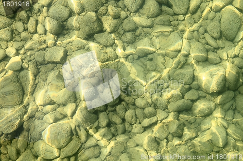 Image of Stony pebbles underwater on lakebed
