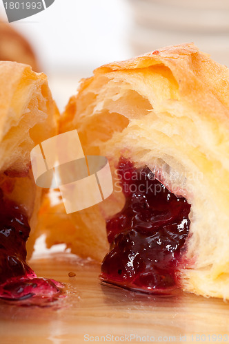 Image of croissant French brioche filled with berries jam