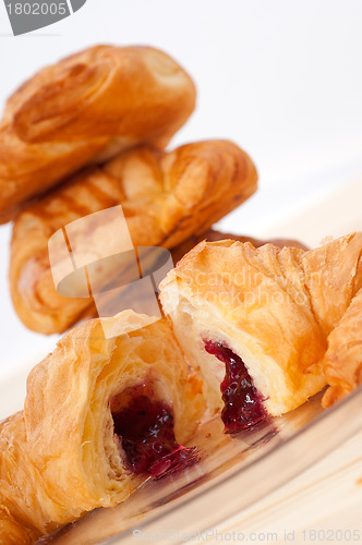 Image of croissant French brioche filled with berries jam