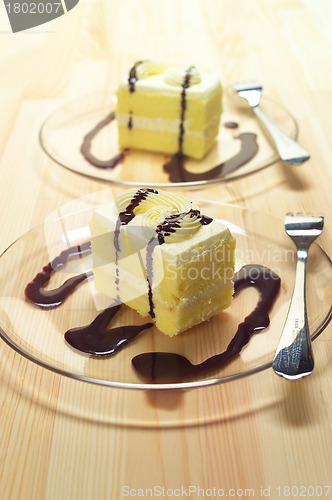 Image of fresh cream cake closeup with chocolate sauce