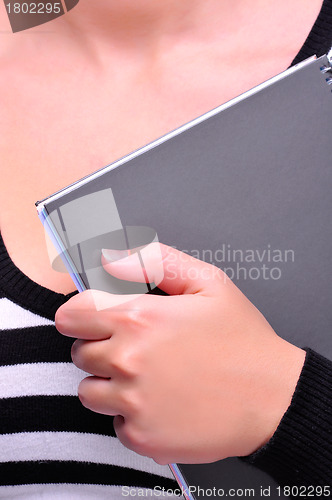 Image of Student holding a pad