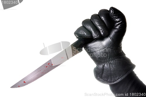 Image of Hand holding bloody knife