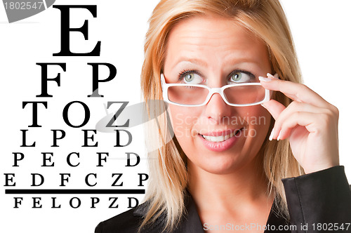 Image of Wondering Businesswoman Looking at an eyechart