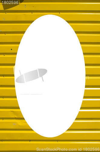 Image of Wall yellow wooden planks and white oval in center 