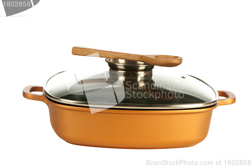 Image of cookware, nonstick pan and wooden spoon
