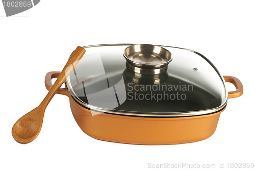 Image of cookware, nonstick pan and wooden spoon