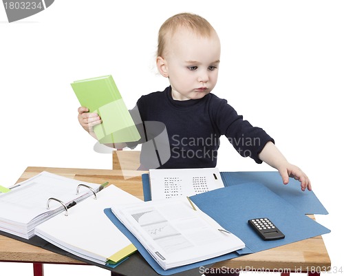 Image of young child at writing desk