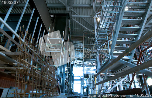 Image of Equipment, cables and piping as found inside of  industrial powe