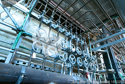 Image of Equipment, cables and piping as found inside of  industrial powe