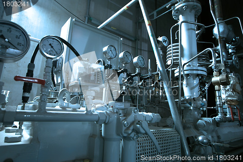 Image of Equipment, cables and piping as found inside of  industrial powe