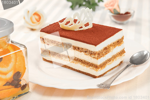 Image of tiramisu cake and silver spoon