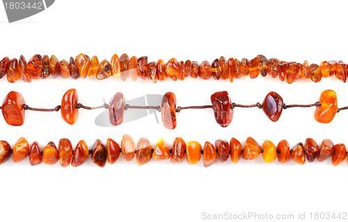 Image of Beads of amber laid in a row