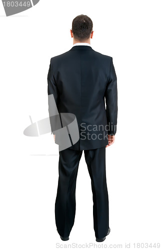 Image of Businessman standing with his back to the studio