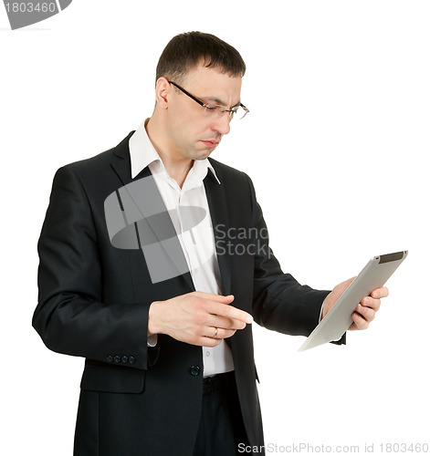 Image of businessman with a tablet PC at a loss