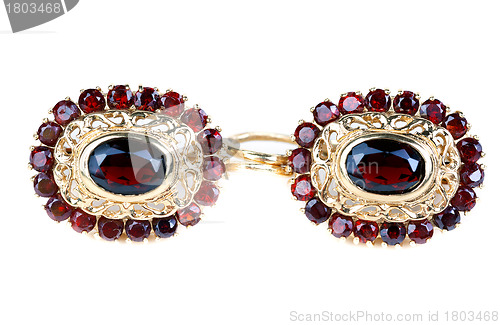 Image of gold earrings with ruby â€‹