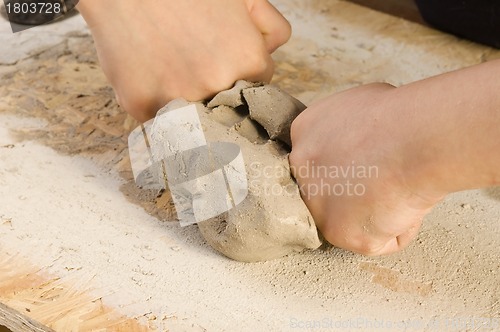 Image of Child hands of a potter