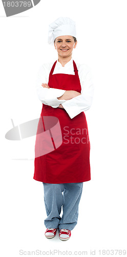 Image of Beautiful aged female chef posing in uniform