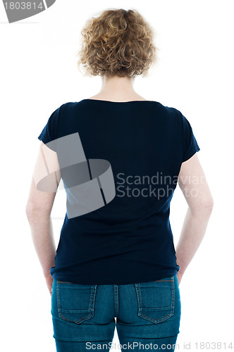 Image of Rear view of curly haired stylish caucasian woman