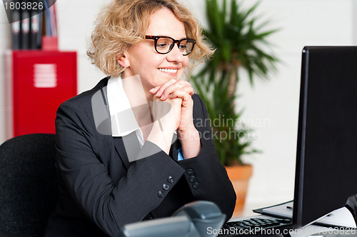 Image of Relaxed portrait of beautiful aged corporate woman