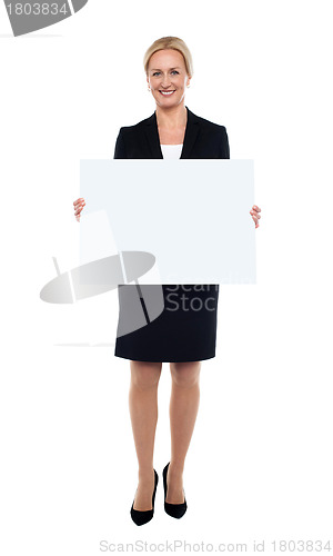 Image of Businesswoman showing blank white billboard