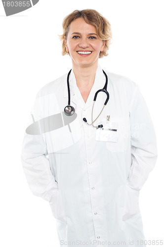 Image of Beautiful female physician in white uniform