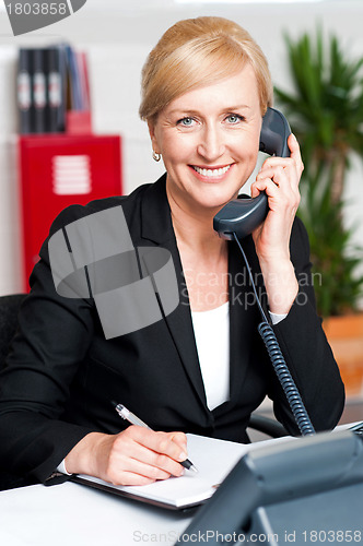 Image of Corporate lady communicating on phone