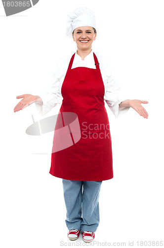 Image of Female chef welcoming you with a smile