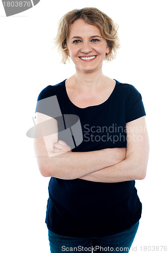 Image of Cheerful casual woman posing with arms crossed
