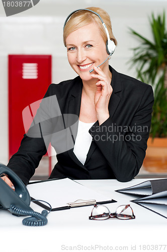 Image of Customer support staff holding mic and communicating