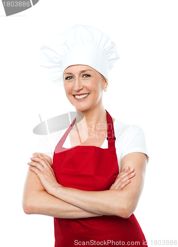 Image of Middle aged female chef posing with crossed arms