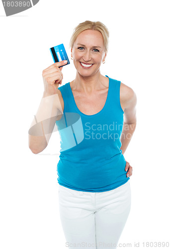 Image of Trendy middle aged woman showing credit card