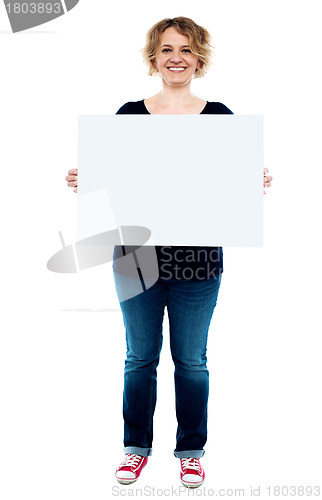 Image of Female showing white blank advertising board
