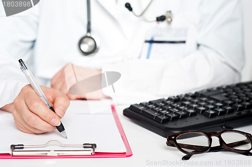 Image of Closeup shot of female doctor writing prescription