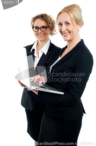 Image of Two corporate women working on laptop